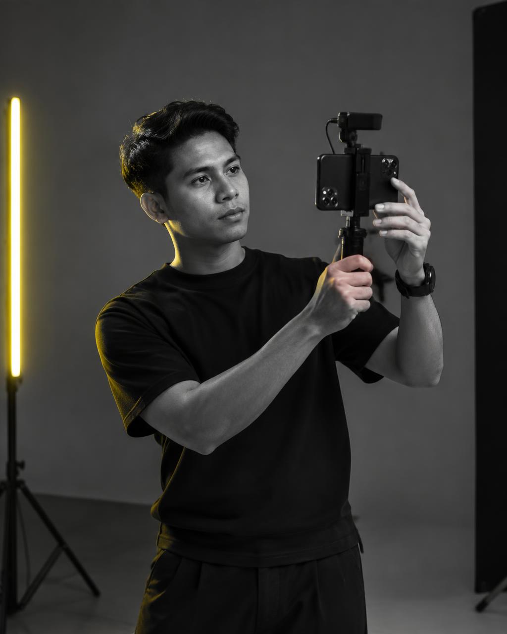 HIVE team member filming social content in the studio
